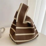 a brown and white bag sitting on top of a table