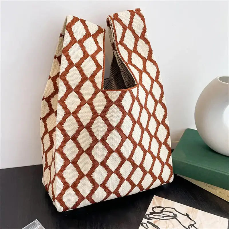 a brown and white bag sitting on top of a table