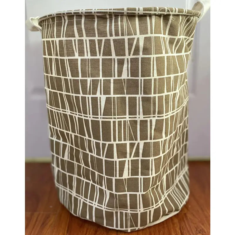 a brown and white basket with a pattern on it