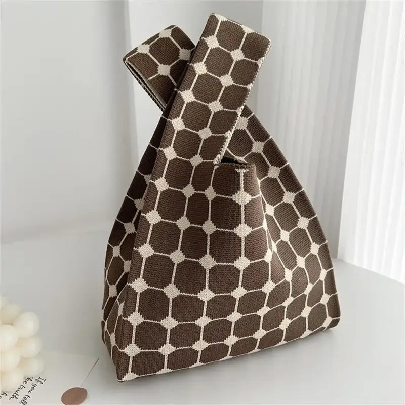 a brown and white gi print bag