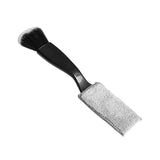 a brush with a black handle