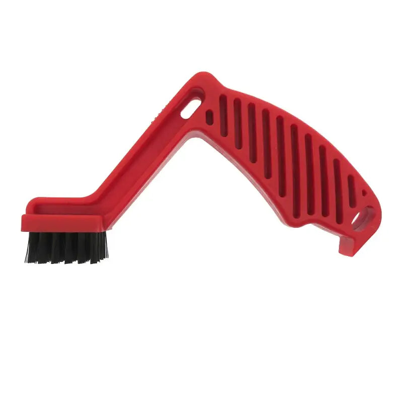 a red plastic brush with a black handle