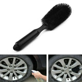 a car wheel brush with a black brush