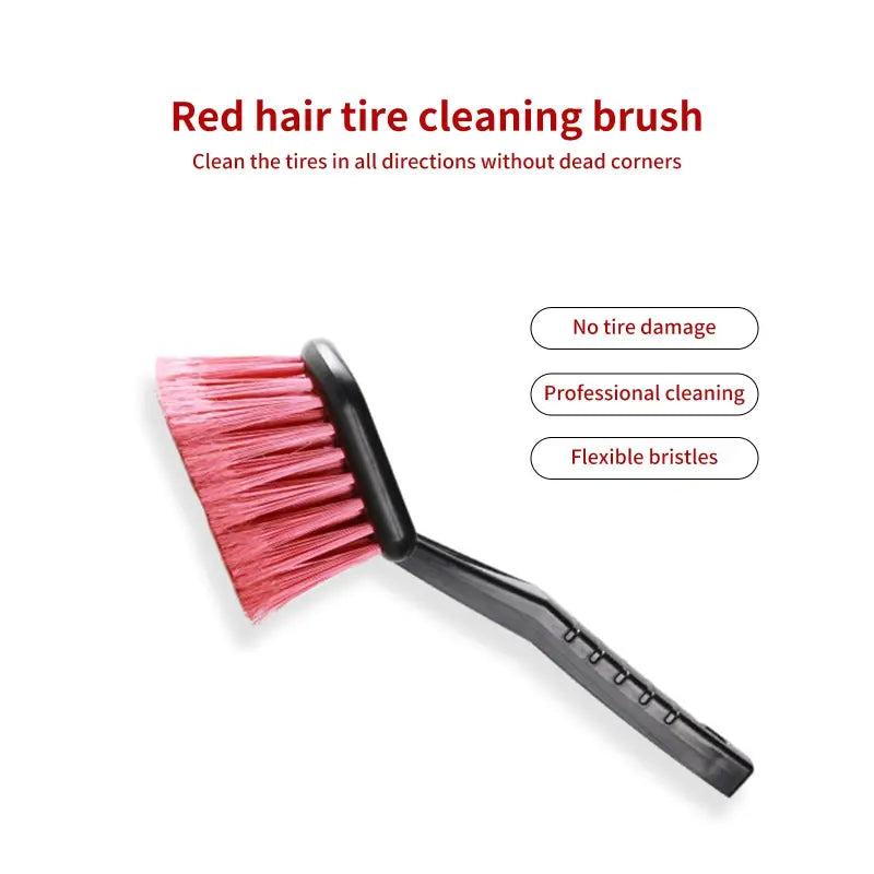 a brush with a red handle and a black handle