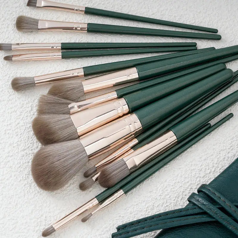 the makeup brush set is shown in a green bag