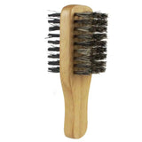 a wooden brush with black bristles on it