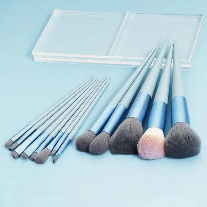 a set of makeup brushes and a mirror