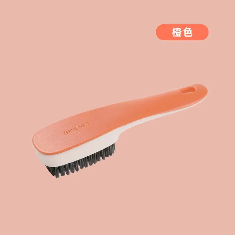a brush with a pink handle
