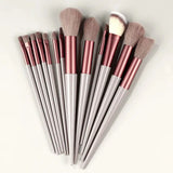 the 7 piece brush set is shown in a white and pink hue