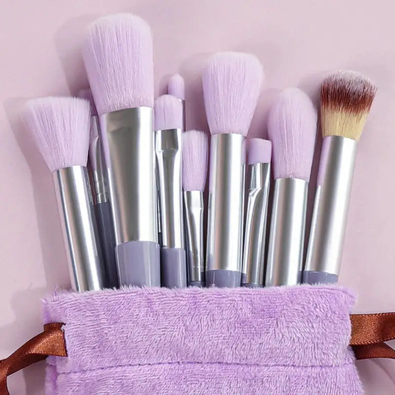 a purple bag filled with makeup brushes