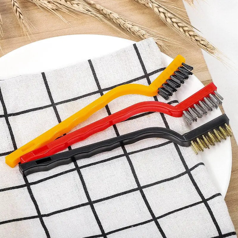 a pair of hair brushes on a white plate