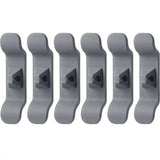 a set of five grey plastic wall hooks