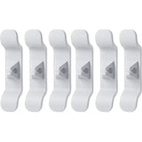 a set of five white plastic wall hooks