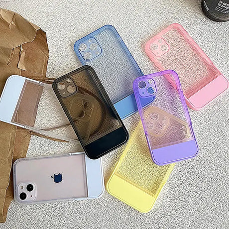 A bunch of different colored cases on a carpet