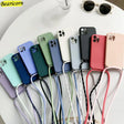 a bunch of iphone cases with a phone strap