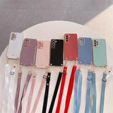 A bunch of iphone cases with a ribbon around them