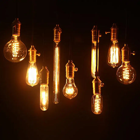 A bunch of light bulbs hanging from the ceiling