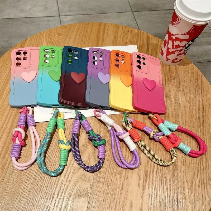 a bunch of phone cases with a phone strap