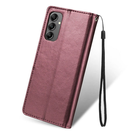 Burgundy leather flip case for a smartphone with a camera cutout and wrist strap.