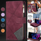 Burgundy leather wallet with geometric stitching and a zipper compartment.