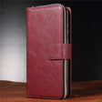 Burgundy leather wallet-style phone case with a zipper and snap closure.