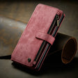 Burgundy leather wallet-style phone case with a zipper compartment.