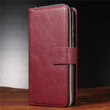Burgundy leather wallet-style phone case with a zipper and clasp closure.