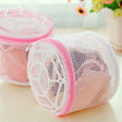 two mesh bags with pink handles