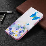 a phone case with a butterfly and flowers