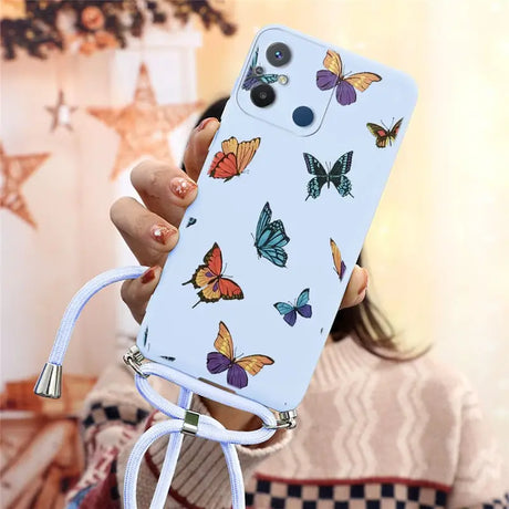 a woman holding a phone case with butterflies on it