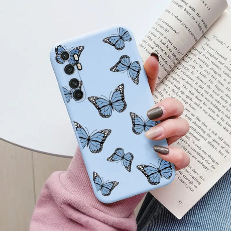 a woman holding a book and a phone case