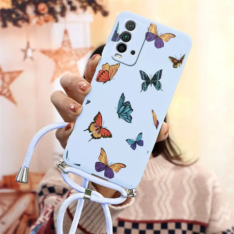 a woman holding a phone case with butterflies on it