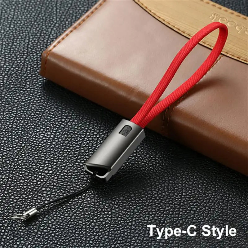 a red cable with a black and white cord