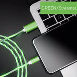 a green cable connected to a laptop