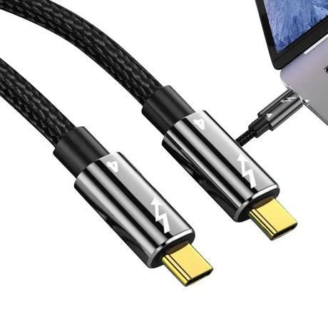 a usb cable with a laptop in the background