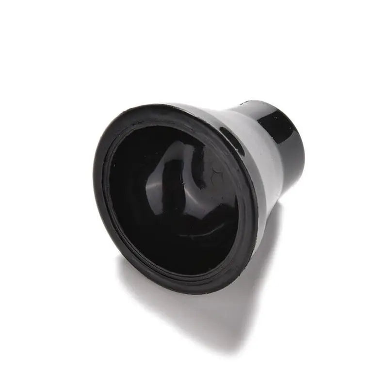 a black knob with a white background