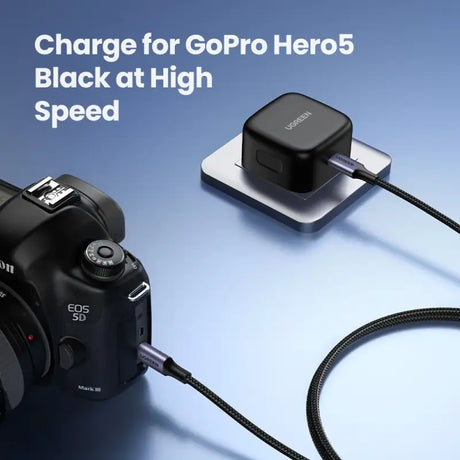 A camera with a charger attached to it