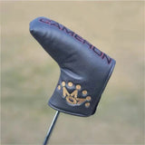 a golf club head cover with a gold logo