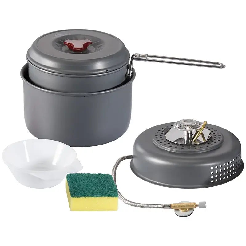 the camping stove with a small pot and a small bowl
