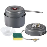 the camping stove with a small pot and a small bowl