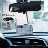 a car dashboard with a phone in the center