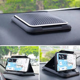 a car dashboard with a phone and a gps device