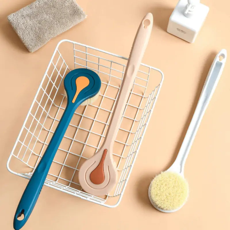 a basket with a brush, brush and sponge