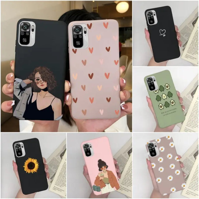 a woman holding a phone case with hearts on it