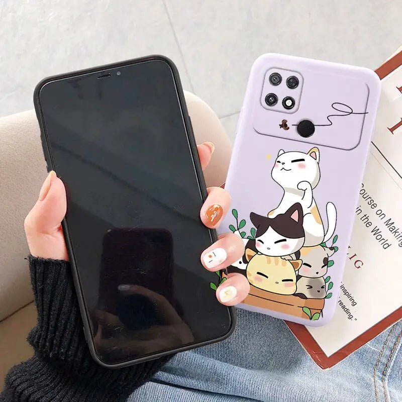 a woman holding a phone case with a cartoon cat