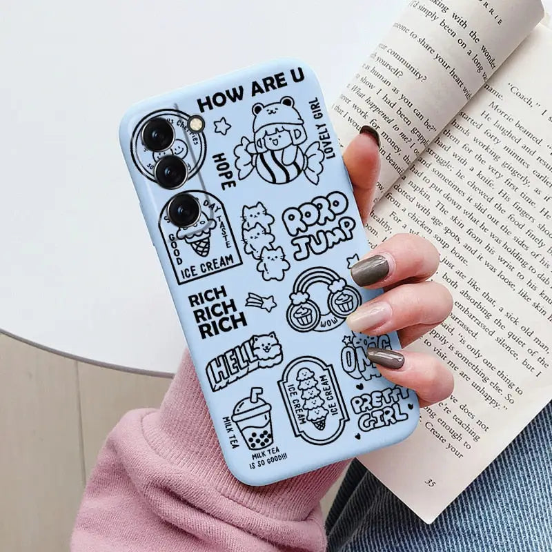 a woman holding a book and a phone case