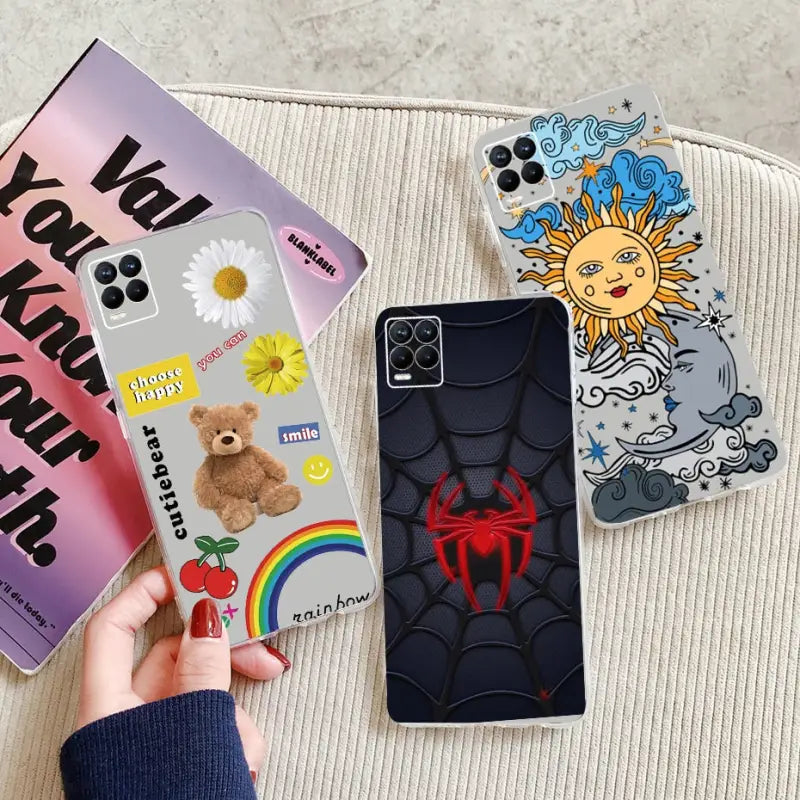 a hand holding a phone case with cartoon characters on it