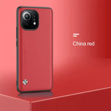 the red iphone case is shown on a red surface