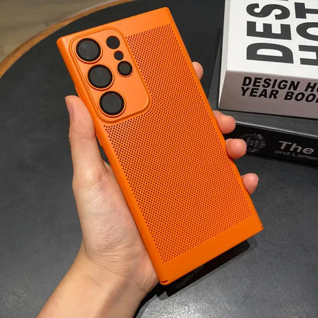 the case is orange and has a black dot pattern