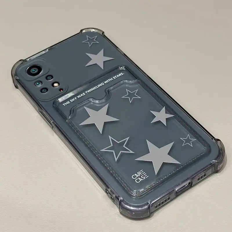 the back of a black iphone case with stars on it
